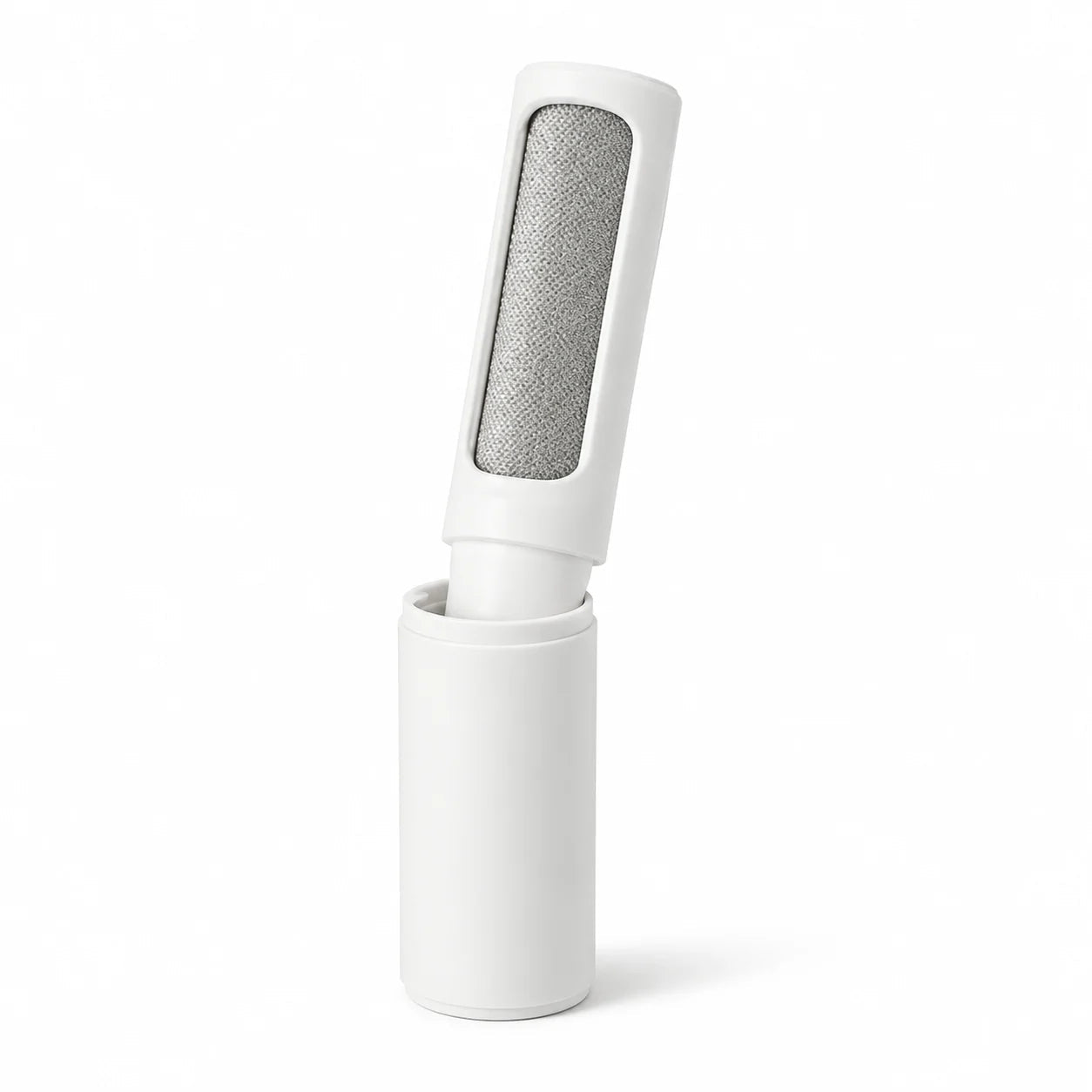 White Snout & Sofa self-cleaning pet hair brush docked in its base