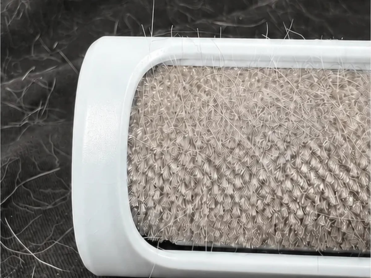 Close-up of the Snout and Sofa directional brush collecting loose hair
